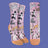 Pair of socks with cat illustrations on a pink background