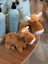 Adorable brown highland cow stuffed animal with white horns snout and fluffy head fluff plush toy