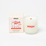 Milkgjar assless chaps scented coconut soy candle in frosted glass with red saddle leather branding 8oz