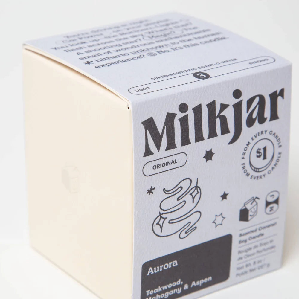 White cardboard box for aurora mahogany teakwood and aspen coconut soy wax scented candle with black text and illustrations