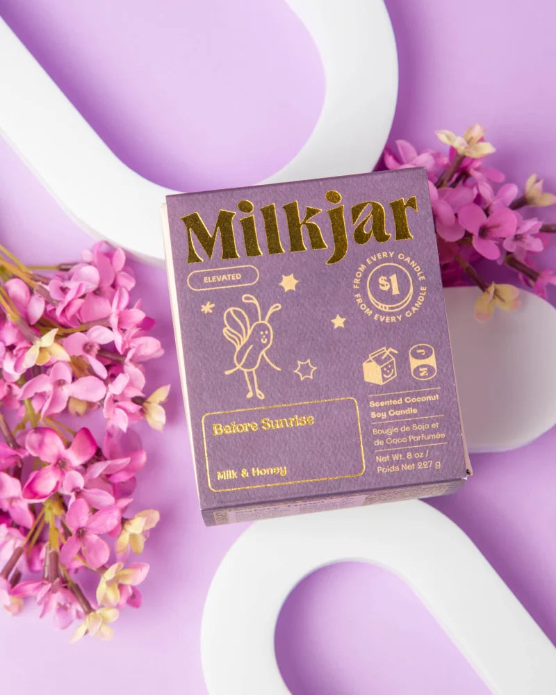 Before sunrise milk and honey scented purple milkjar coconut soy candle by angus oliver complements sheepskin rugs