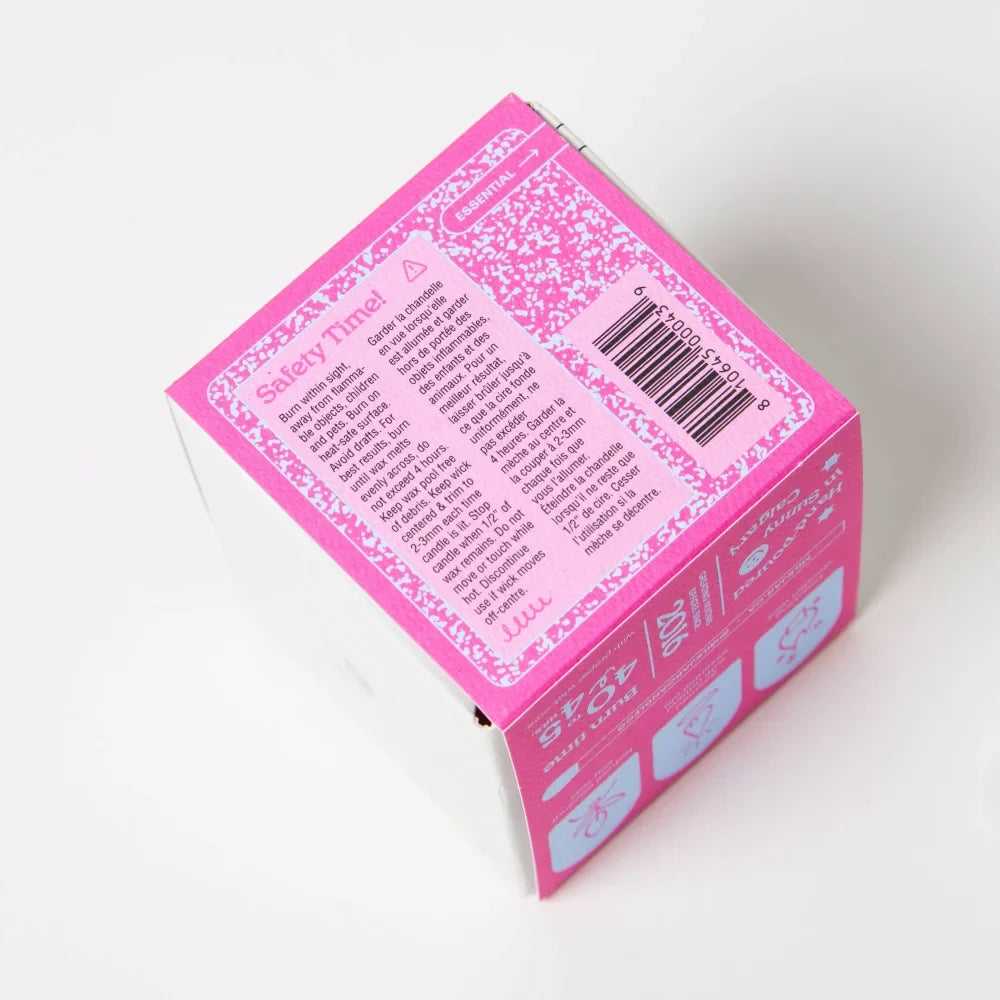 Back of pink bloom essential oil coconut soy 8oz candle box with white floral pattern labeled safety time by angus oliver