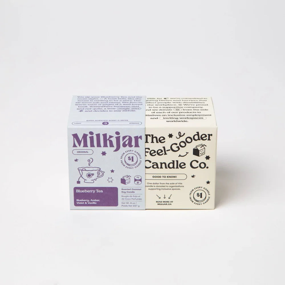 Purple and white cardboard box of milkjar blueberry tea soy wax candle with coconut soy wax and vanilla amber notes