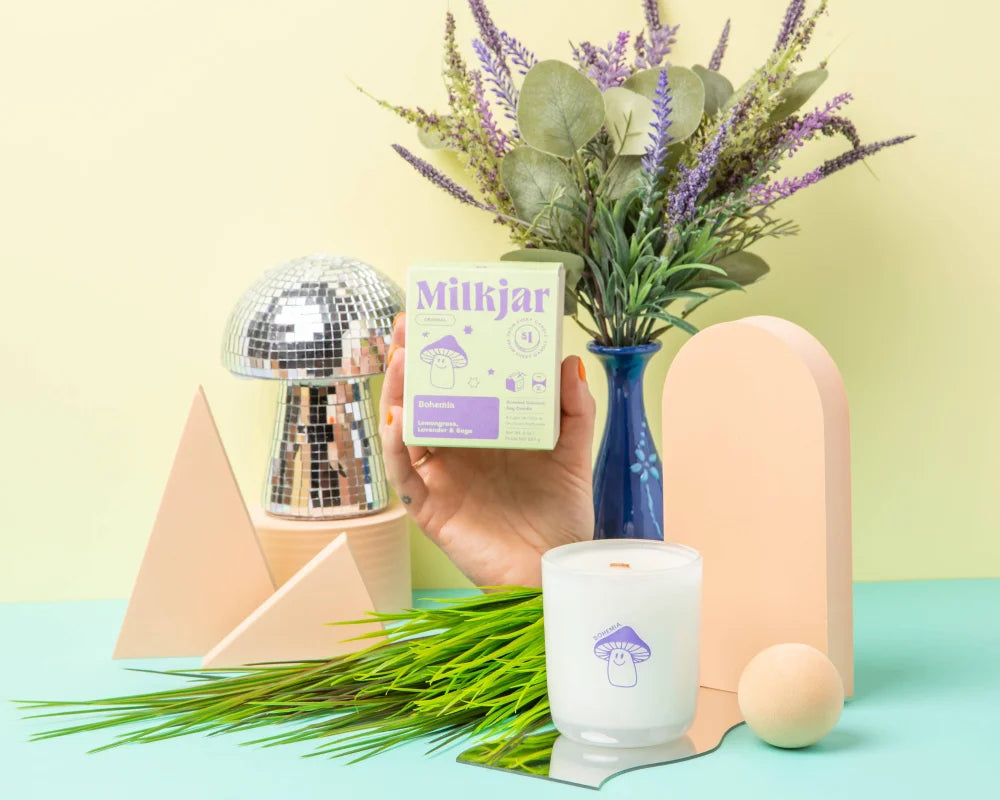 White candle with purple mushroom design made from coconut soy wax lemongrass lavender sage 8oz candle