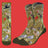 Socks with bird and nature pattern on a green background