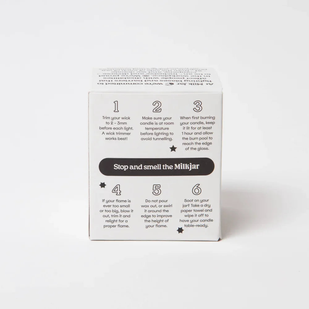 White cardboard box with instructions on the back for using citrus essential oil coconut soy candle in an 8oz glass jar