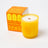 Vibrant yellow glass candle with wooden wick and embossed orange design made with essential oil coconut soy blend