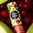 A cylindrical tube of mae mae cranberry apple natural lip balm with a bright yellow and red label with fruit illustrations