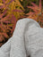 A soft light gray calgary cardigan made from zealand wool with a textured ribbed pattern and soft fleece feel
