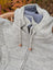 Cream woolen calgary cardigan in light gray knit with soft fleece blue lining and wooden toggle pulls made from zealand wool