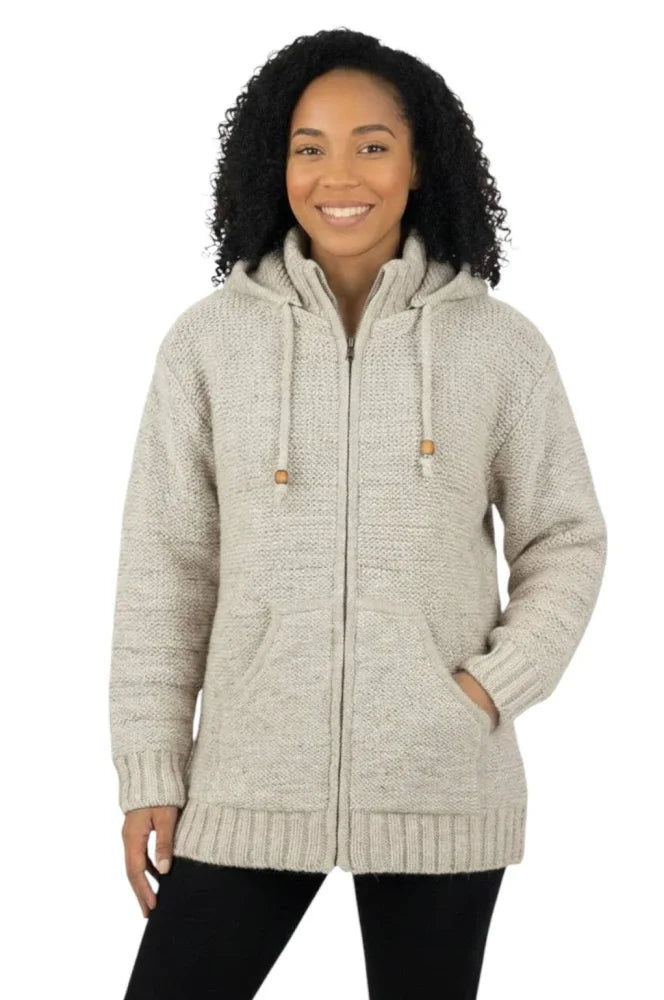 A cozy cream woolen calgary cardigan with soft fleece lining and wooden toggle drawstrings for warmth and comfort