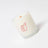 A white frosted glass coconut soy candle with a red thumbs up and dandy label by angus oliver