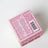 Back of pink speckled cardboard box for dandy mahogany firewood & pine coconut soy candle by angus oliver