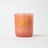 A peach frosted glass candle jar with milkjar in gold lettering featuring coconut soy darjeeling patchouli santal scent