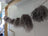 Dark mushroom sheepskin pom poms with gray curly hair garland on rope