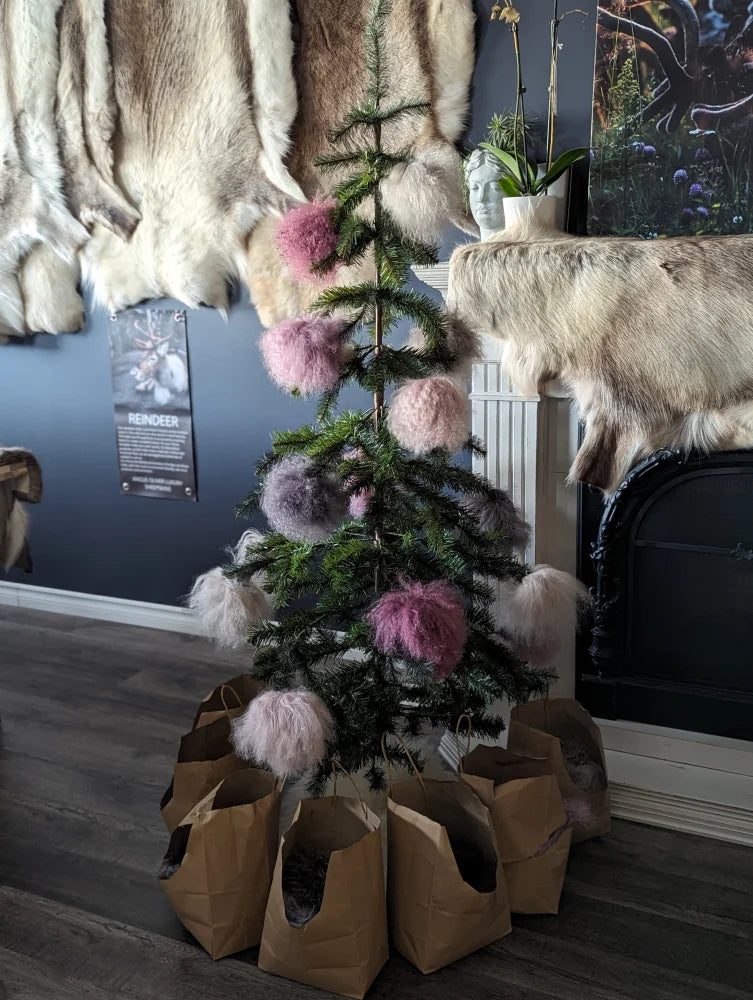 Dark pink sheepskin pom-pom Christmas tree ornaments in pink, white, purple