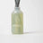 A translucent green glass milkjar reed diffuser with frosted finish labeled fresh laundry featuring rain cotton and french vanilla scent by angus oliver