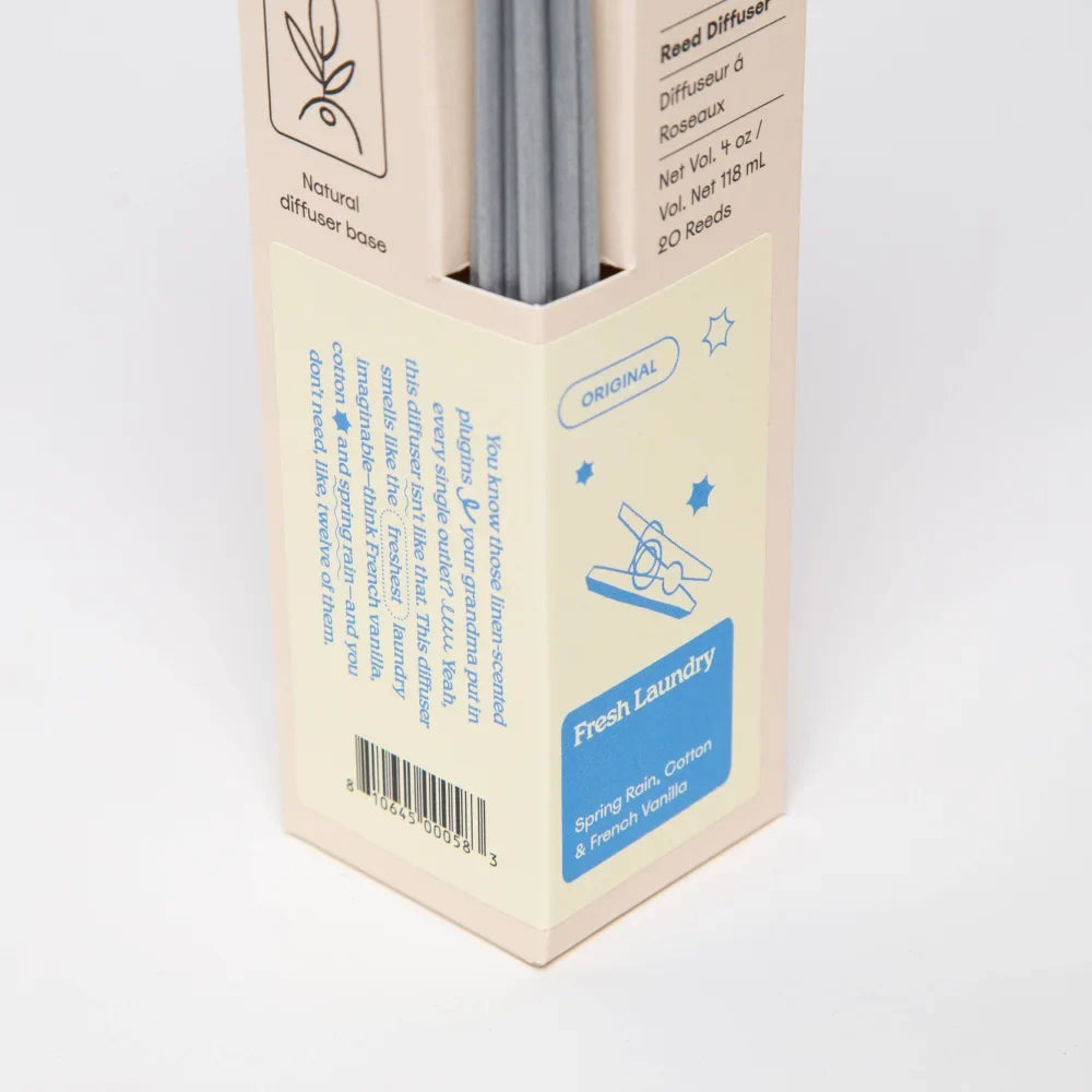 Beige cardboard box with silver reed diffuser sticks labeled fresh laundry scent for angus oliver french vanilla reed diffuser
