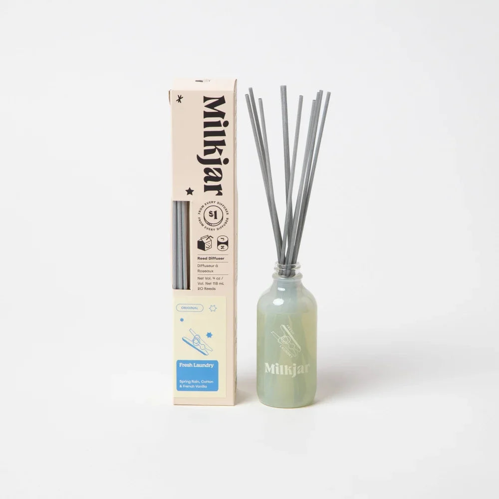 Milijar fresh laundry 4oz reed diffuser in pale green glass bottle with silver reeds featuring french vanilla scent