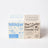 Two rectangular cardboard candle boxes in light blue and beige for fresh laundry soy candles with french vanilla scent