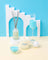 White cylindrical soy candle with blue milkjar branding fresh laundry scent featuring french vanilla by angus oliver