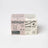 Pink and white cardboard box for golden hour milk jar candle with black text and star illustrations made of coconut soy wax