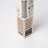 A beige cardboard box with gray reed diffuser sticks labeled golden hour featuring cashmere cedarwood and musk scent notes