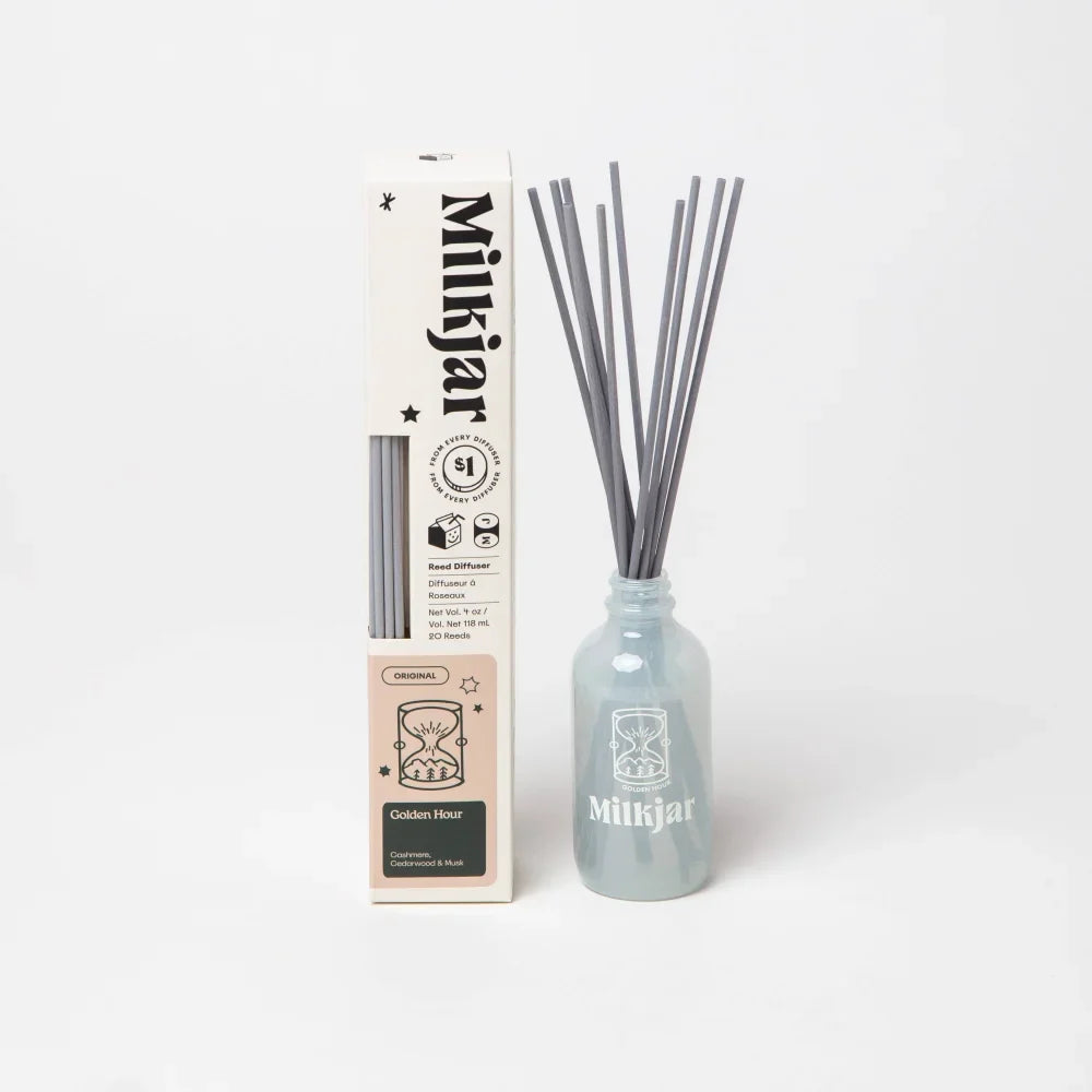Milkyjar golden hour reed diffuser in frosted light blue glass bottle with gray reeds for cashmere cedarwood musk scent