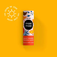A colorful cylindrical tube of mae mae punch hawaiian punch lip balm with zinc oxide and a tropical design