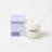 A creamy white hygge vanilla tobacco cedar coconut soy candle in a clear glass jar with wooden wick and teal branding