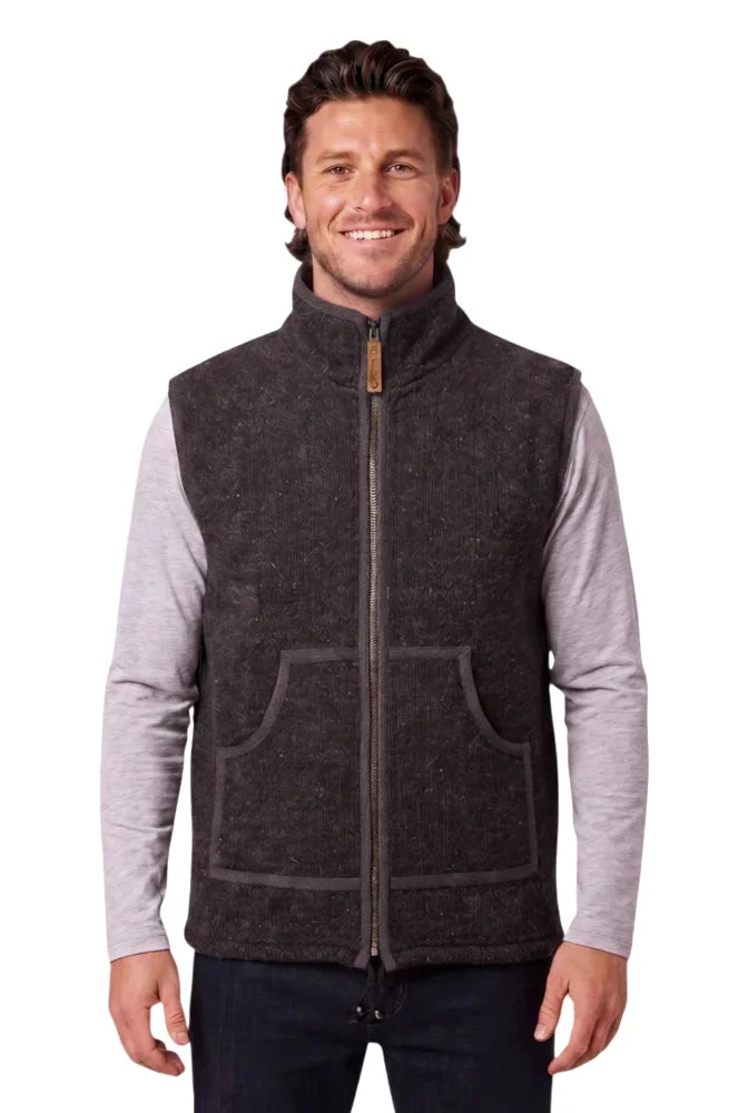 Dark gray jasper vest with high collar, front zipper, two patch pockets made of soft fleece and zealand wool