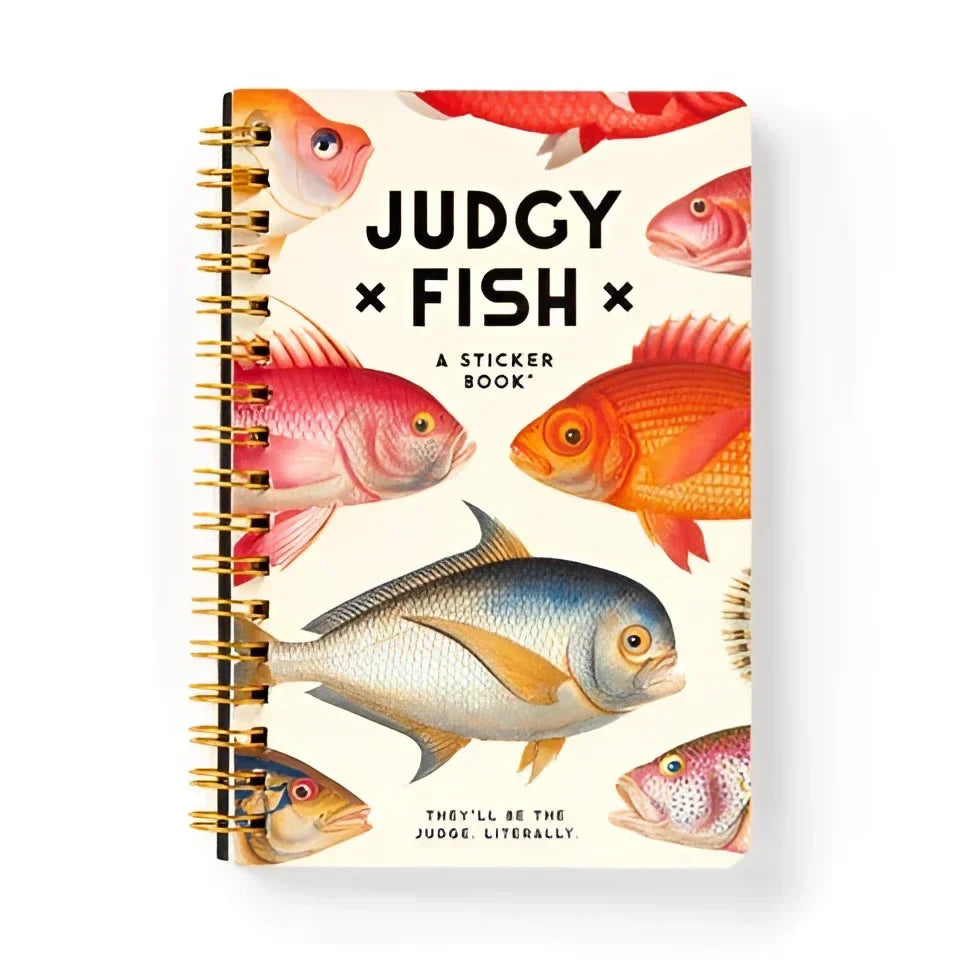A spiral-bound judgy fish sticker book with colorful fish illustrations cream cover and gold-toned binding