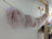 Cozy light pink sheepskin pom pom cat hammock chair by Angus Oliver