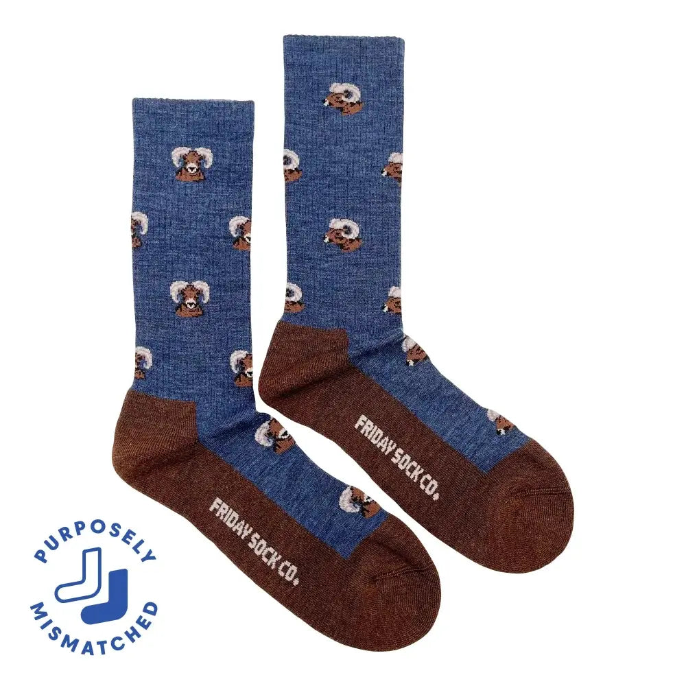 Men’s all-season hiking merino wool socks in blue and brown with cartoon skunk faces and friday sock co heel branding