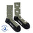 Olive green merino wool socks with white bird and binocular patterns black toe and heel by friday sock co for outdoor cozy wear