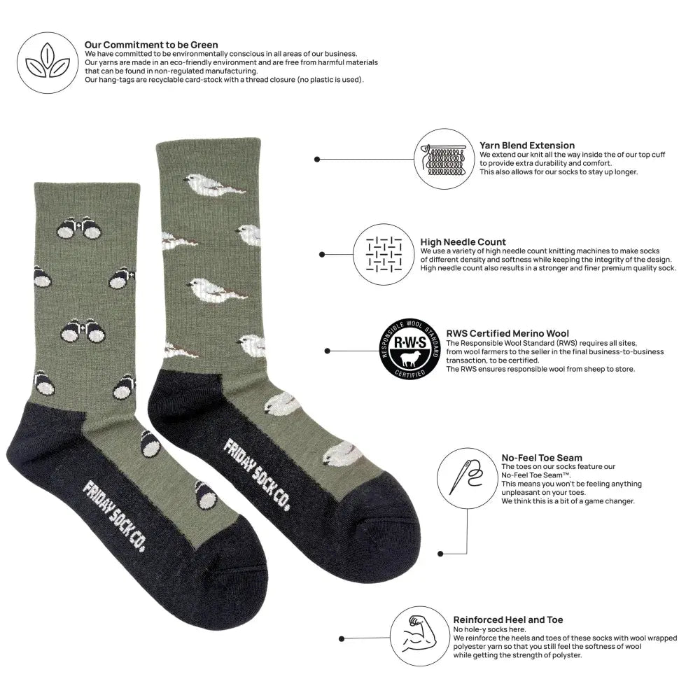 Olive green merino wool socks with white bird patterns black toes and heels featuring friday sock co branding for outdoors