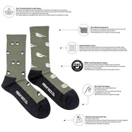 Olive green merino wool socks with white bird patterns black toes and heels featuring friday sock co branding for outdoors