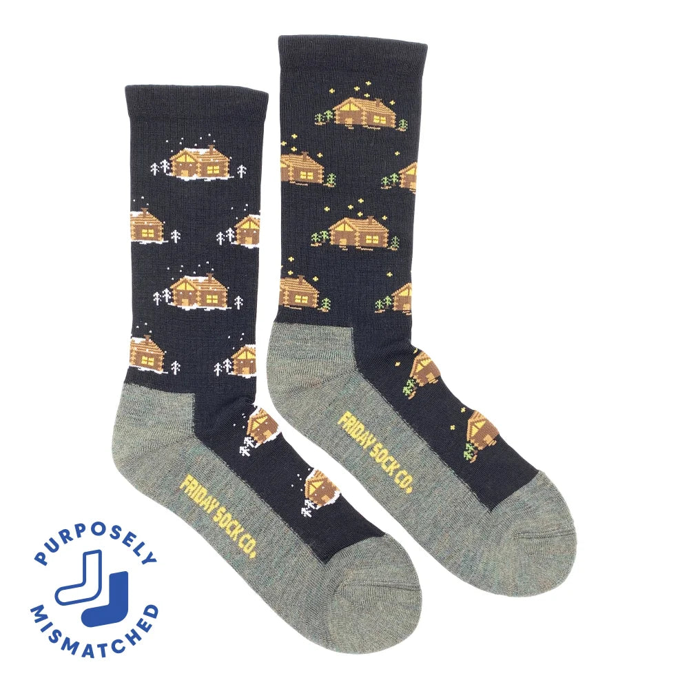 Men’s dark blue merino wool crew socks with pixelated cabin and snow design and gray heel and toe accents
