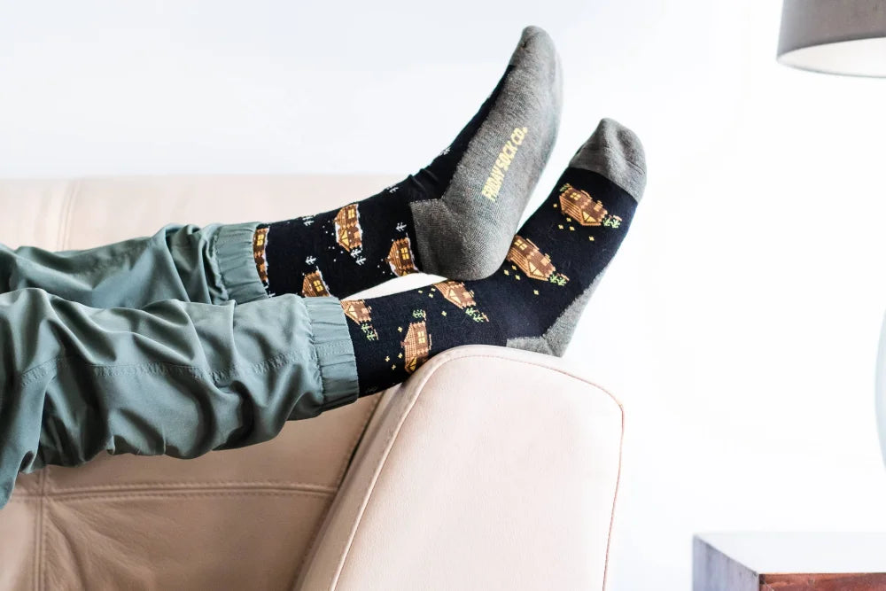 Men’s cabin merino wool socks with golden starry spaceship pattern and gray toe caps, moisture wicking soft