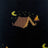 Men’s black merino wool socks with pixelated campsite design featuring brown mountains crescent moons and flames