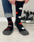 Men’s canada merino wool socks in black with red white maple leaf pattern and gray toe and heel for soft comfort