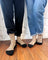 Beige merino wool socks with black toes and heels featuring colorful vintage camper vans for warm breathable wear