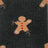 Dark gray merino wool socks with tan gingerbread man and red icing details for outdoor cozy wear