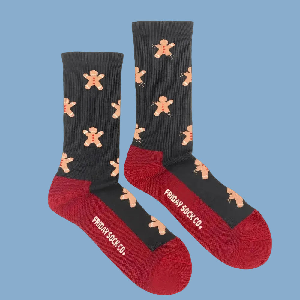 Men’s gingerbread bite merino wool socks by friday sock co black and red wool socks with gingerbread men pattern