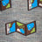 Gray merino wool socks with a pixelated map design featuring brown borders blue water and green landmasses