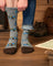 Men’s gray merino wool socks with brown toe and heel featuring printed maps and mountain scenes for outdoors use