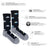 Men’s merino wool socks in black with gray toes and heels featuring white mountains and blue clouds pattern