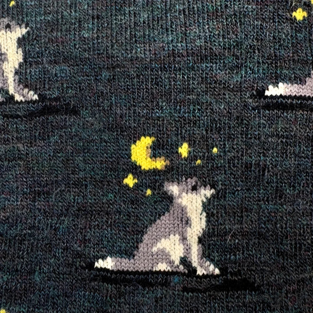 Dark green merino wool socks with a pixelated wolf under a yellow crescent moon and stars for men