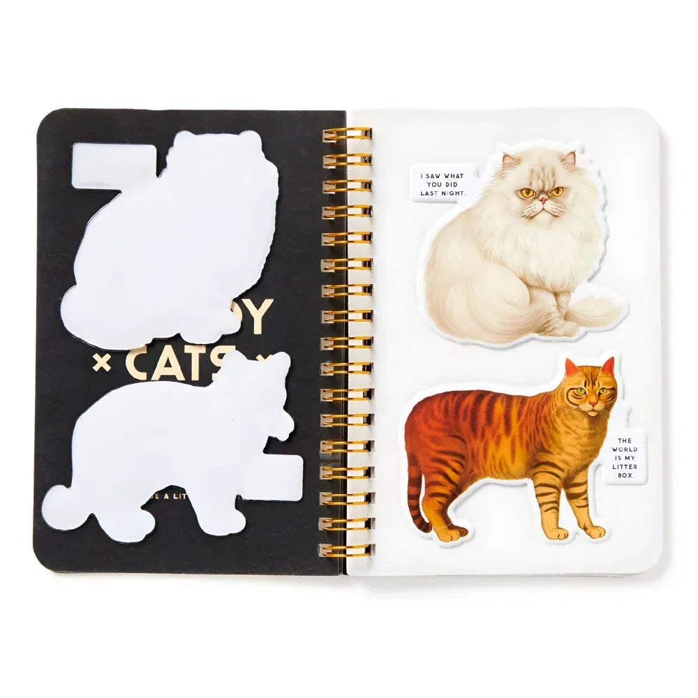 A black and white spiral notebook with cats sticker book featuring fluffy cream persian and orange tabby cats