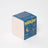 Blue and cream milkjar candle box with smiling moon illustration for moonrise neroli and plum coconut soy candle